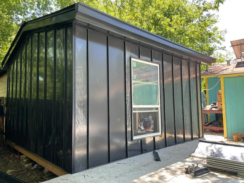 Black standing seam metal wall panels for Roof Inspection in Andover